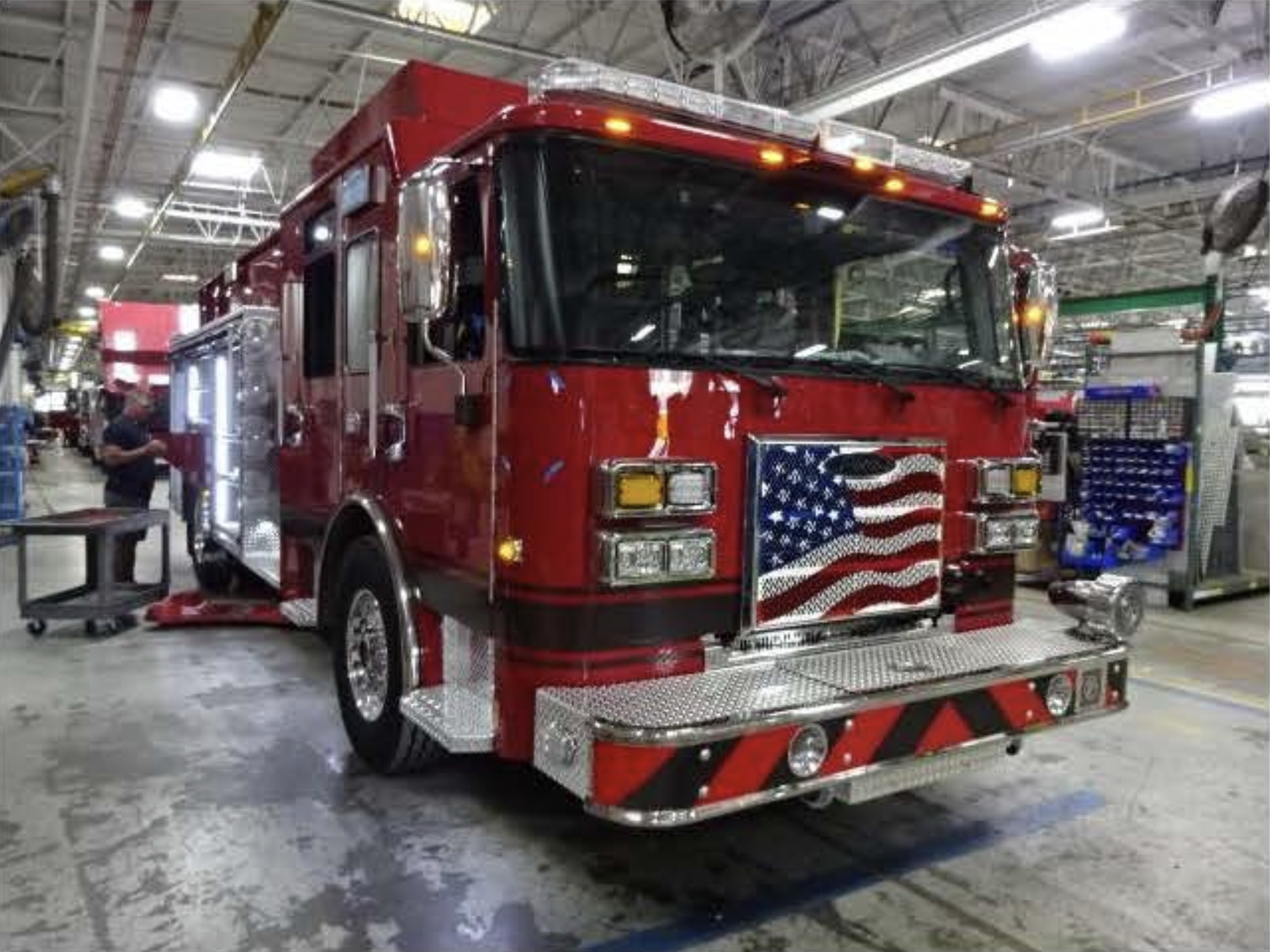 Hollowell Red Fire truck with American flag on front grill